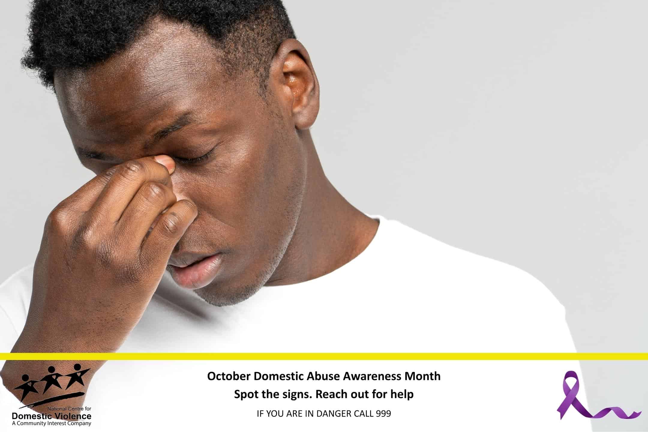 Man holding bridge of nose in sadness.